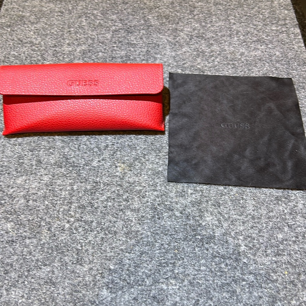 Guess glasses case with cloth (red). Like new.